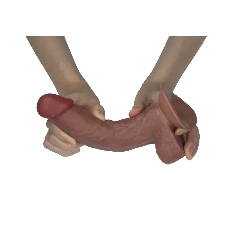 Brown dildo held by hands on a white background