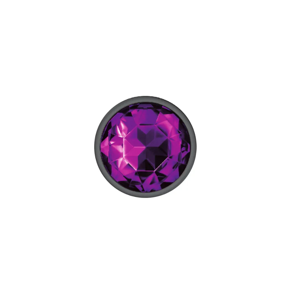 Purple gemstone with black border on a white background