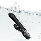 Black massager with 'Viben' branding submerged in water with splashes.