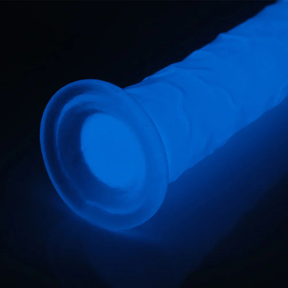 Blue glowing dildo against a black background