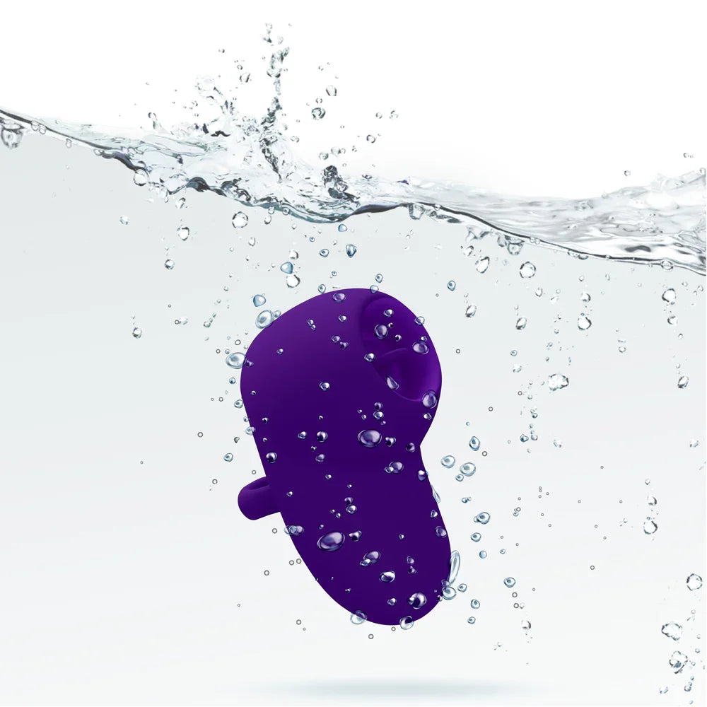 Purple foot-shaped object with water splashes on a white background
