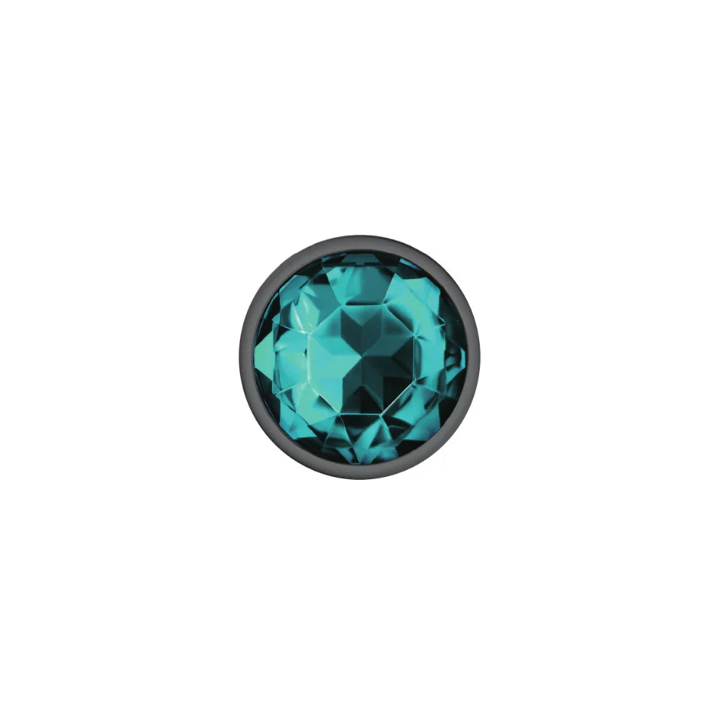 Teal gemstone with black setting on a white background