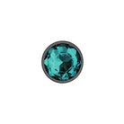 Teal gemstone with black setting on a white background